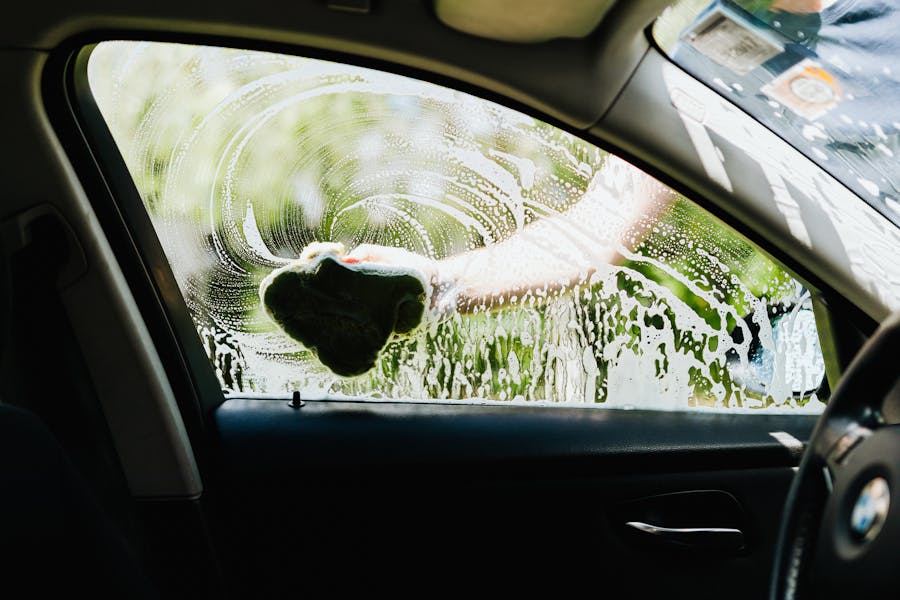 Car glass and mirror cleaning with a microfiber cloth