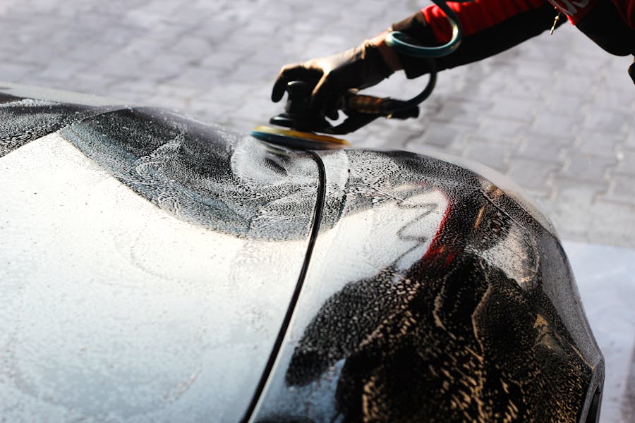Car paint being polished for a glossy finish